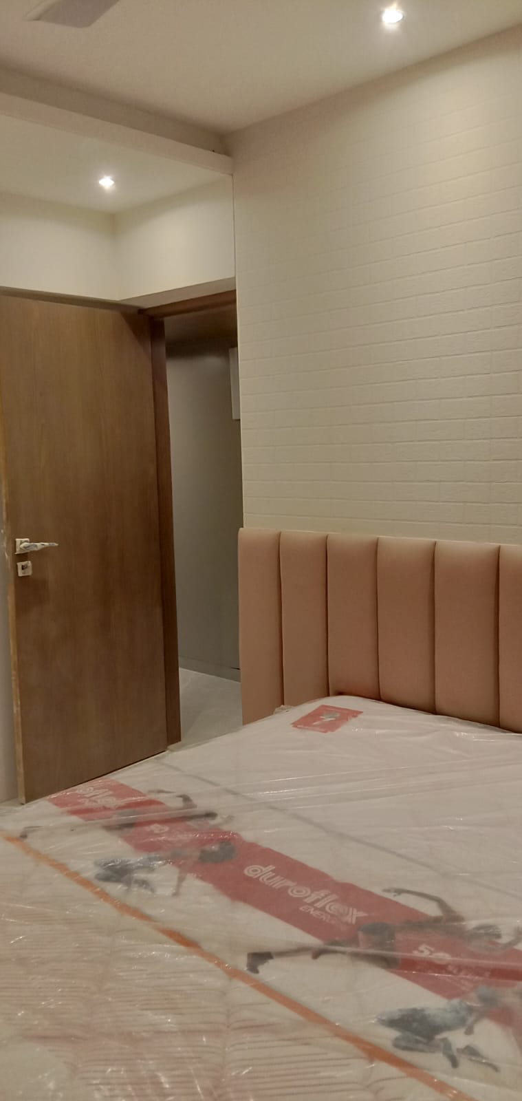 Master Bedroom Channel Tufted Headboard with Textured Brick Wall