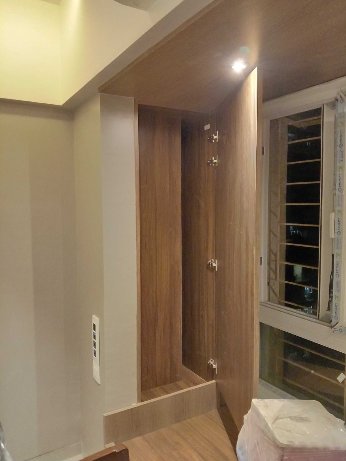 Built-in Walnut Corner Wardrobe Unit with Integrated Lighting