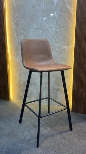 Sleek Tan Leather Breakfast Bar Stool with Ambient Wall Niche
