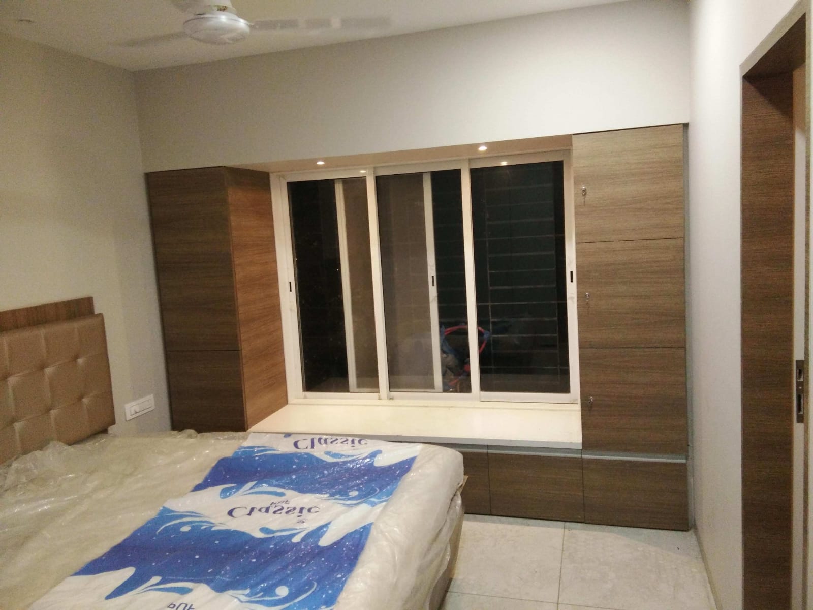 Master Bedroom Bay Window Seating Ledge with Walnut Side Storage