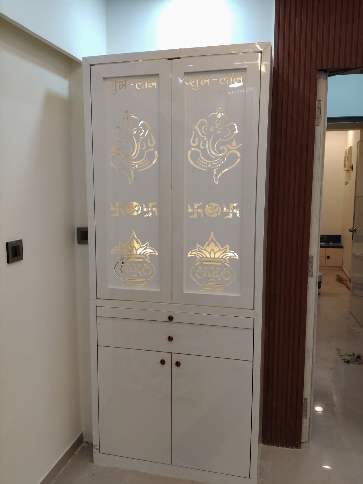 High-Gloss White Ganesha Pooja Mandir with Backlit Cutout Doors